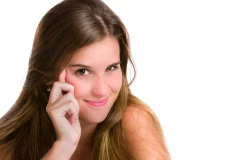 Mischievous or evil Hispanic young woman expression. Isolated on white Stock-Fotos