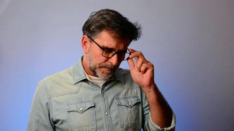 Miserable depressed dramatic bearded mature guy in jeans shirt experiencing loss Stock-Footage 148236654