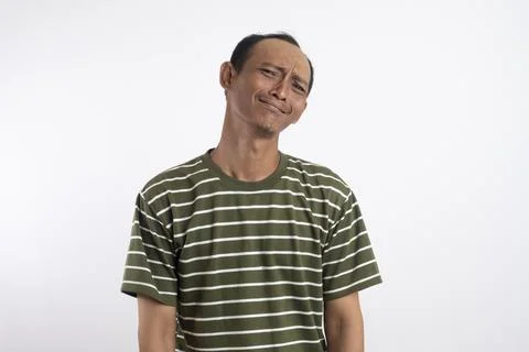 Miserable displeased man has sick look, red swollen eyes, smirks face, suff.. Stock Photos