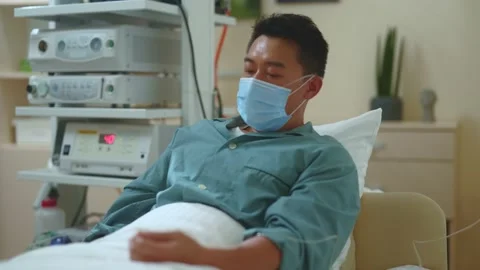 Miserable exhausted asian man suffering bad condition disease symptoms Video stock 142594079