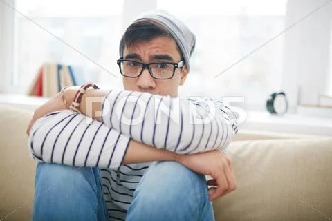 Miserable guy looking at camera Stock Photos