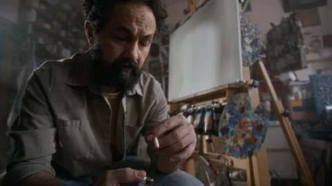 Miserable Painter Sitting in Studio, Holding Cigarette, Waiting for Inspiration Stock Footage 334684515