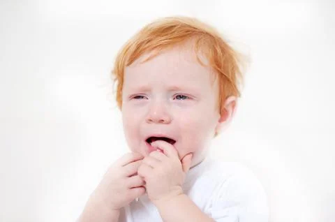Miserable redhead boy crying Stock Photos