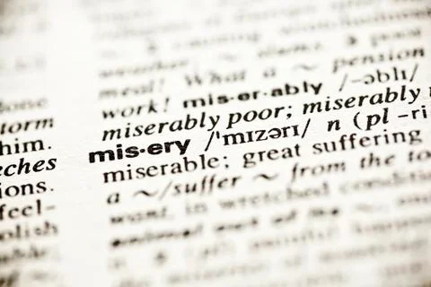'misery' - dictionary definition vignette Stock Photos