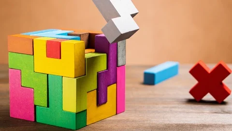 Missed items are setting in the colorful wooden cube puzzle. Stock Footage 120180357