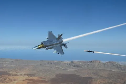 A missile attacks a modern fighter jet as it flies over the ground Stock Photos
