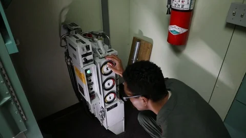 Missile combat crew operating equipment at launch control center Stock Footage 111414514