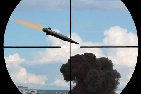 Missile flying through sniper scope crosshairs above dark explosion and cloud Stock Photos