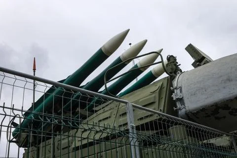 Missile launch rocket launcher behind an iron fence at a military base Stock Photos