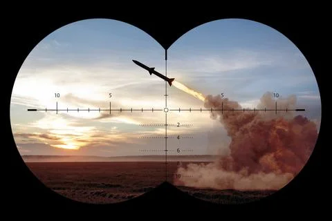 Missile launch viewed through a binocular sight at sunset Stock Photos