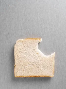 Missing bite from a slice of bread Stock Photos