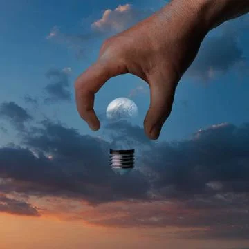 A missing bulb a missing light bulb in the hand Copyright: xZoonar.com/ser... Stock Photos