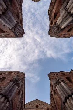 Missing ceiling opening the view to the sky in the destroyed abandoned Cist.. Stock Photos