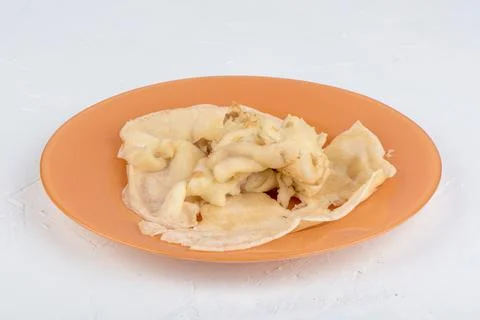 Missing first pancake on a plate. The first pancake is lumpy. Stock Photos