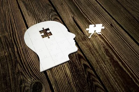 Missing jigsaw of human head build out of puzzle pieces on wood planks, with Stock Illustration