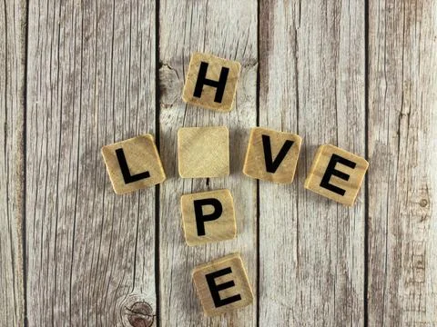 Missing Letter Puzzle Educational Word Game – HOPE and LOVE Crossword Concept Stock Photos