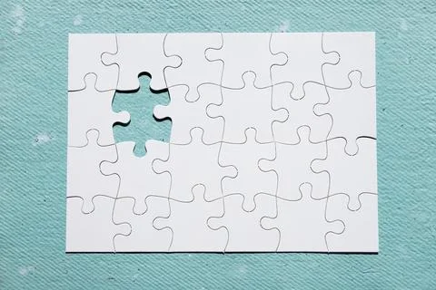 Missing piece puzzle blue textured backdrop Stock Photos