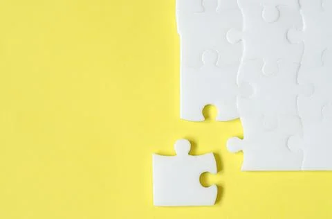 The missing piece of the puzzle. Last piece of jigsaw puzzle Stock Photos