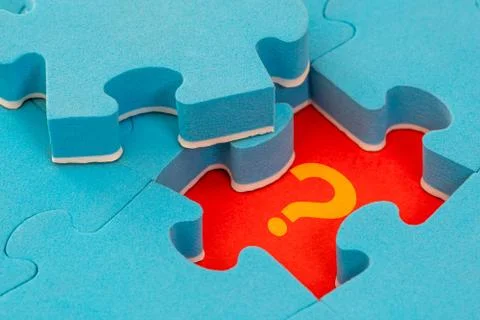 Missing piece of the puzzle with question mark Stock Photos