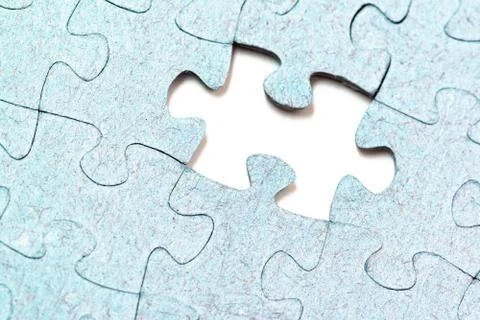 Missing puzzle piece and light blue puzzle pieces Stock Photos