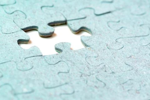 Missing puzzle piece and light blue puzzle pieces Stock Photos