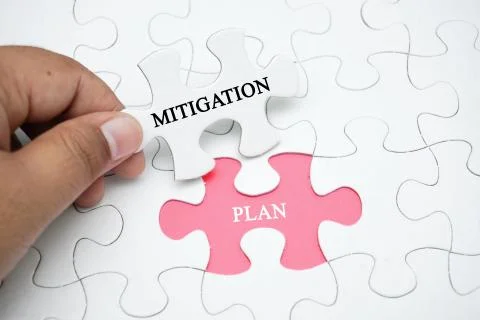 Missing puzzle with a word Mitigation Plan Stock Photos