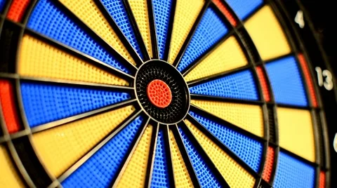 Missing the target bull's eye at dart game closeup Video stock 59570321