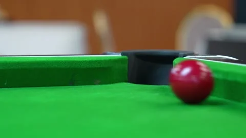 Missing the target red ball in blackball Pool game on a green cloth pool table Stock Footage 302510927