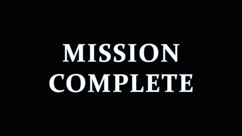 Mission Complete text appearing on black background with cinematic motion d.. 库存影片 344036805