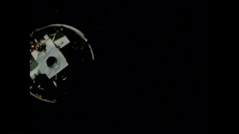 Mission control watch as a command module attach to a lunar module in space Stock Footage 90155521