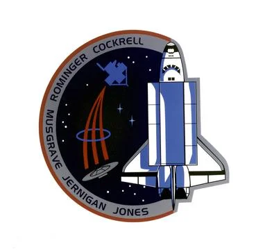 This mission patch for mission STS-80 depicts the Space Shuttle Columbia a... Fotos de archivo