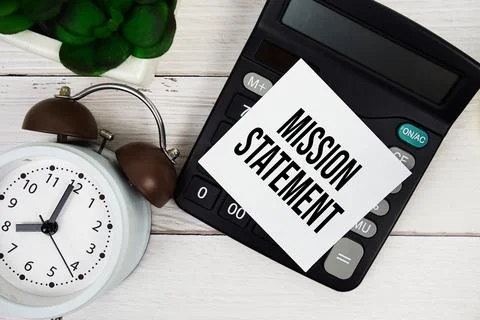 Mission Statement text message on sticky note with alarm clock and calculat.. Stock Photos