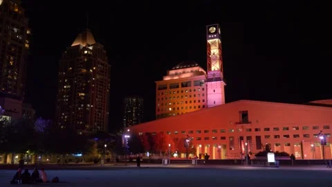 Mississauga city hall at night time during the summer. Pan shot. Stock Footage