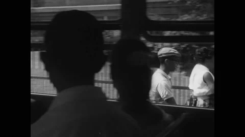MISSOURI - 1955 - White students side eye black students getting off their Stock Footage 277344526