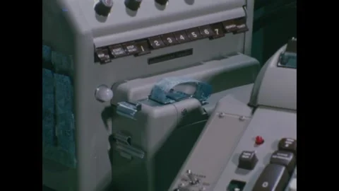 MISSOURI - 1966 - Tape is run through a punch machine at a US Marine data Stock Footage 340669609