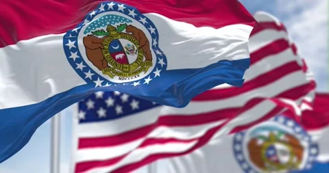 Missouri state flags waving along with the national flag of the United States Stock Footage 196879805