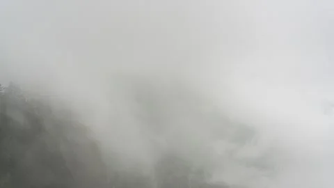 Mist and Clouds Over Mountain Top Timelapse Stock Footage 326698215