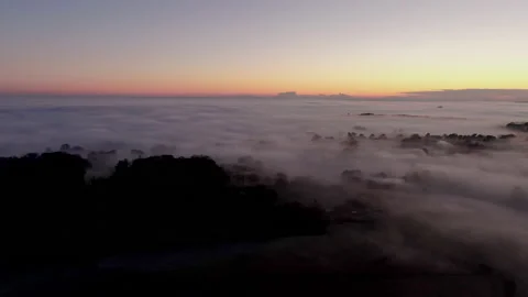 Mist covered landscape at sunset Video stock 145954103