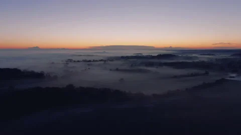 Mist covered landscape at sunset Video stock 145955469