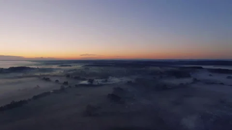 Mist covered landscape at sunset Video stock 145956778