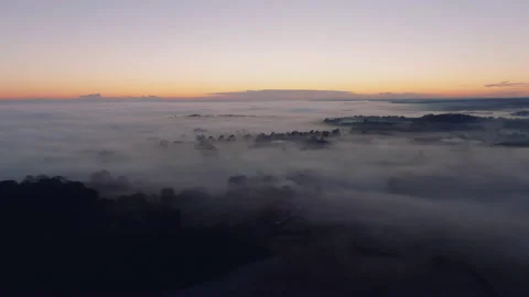 Mist covered landscape at sunset Video stock 145957159
