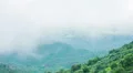 Mist covering mountain peaks. Global warming, climate change. Weather forecast HD Footage