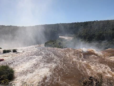Mist from Devil's Throat Falls as seen from the water's edge in Iguazu Nation Stock Photos