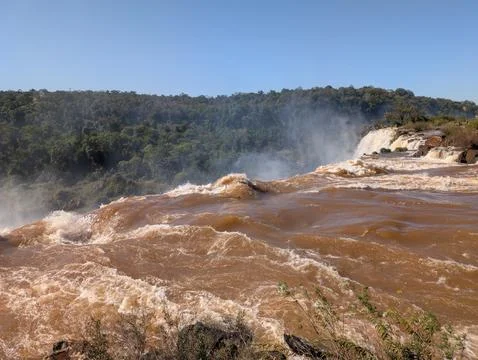 Mist from Devil's Throat Falls as seen from the water's edge in Iguazu Nation Stock Photos