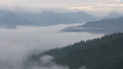 Mist floating in the valley of the Eastern Sayan Stock Footage 61102940