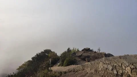 Mist Flowing Over Stone Steps on Sacred Mountain Peak Vídeo Stock 334728546