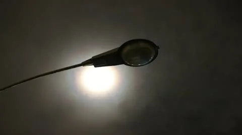 Mist moving over moon behind old streetlight Stock Footage 11300083