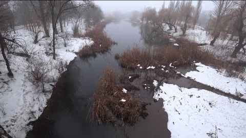 Mist over the current river in the park, snow, thaw, springtime. Stock Footage 102045843