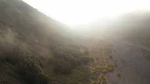 Mist over the mountains. pull away view of mountains and the meadow Stock Footage 258313147