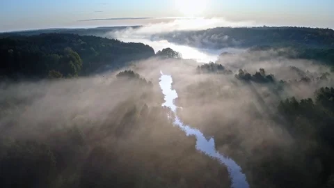 Mist over the river with sunrays, aerial view Stock Footage 119815884